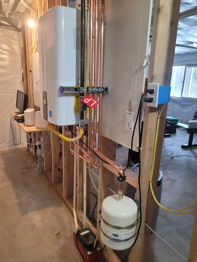 Licensed plumber repairing a kitchen sink in Clever
